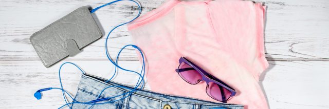 Female casual summer clothing collection overhead - clothes and electronics