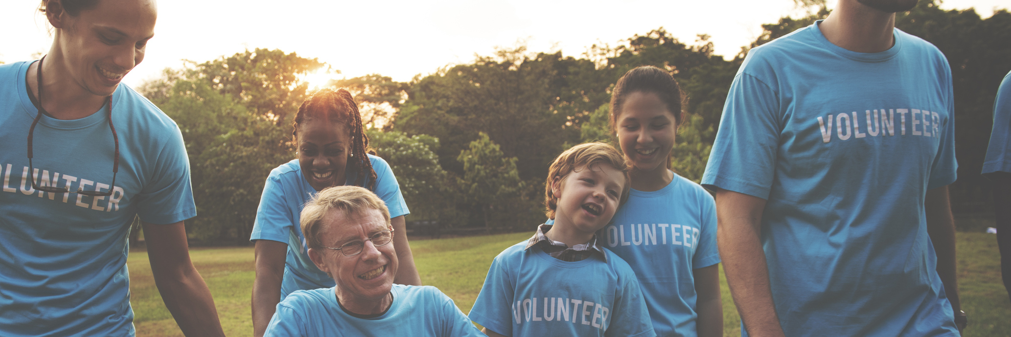 What to Consider Before Volunteering If You Have a Chronic Illness group of volunteers in the park