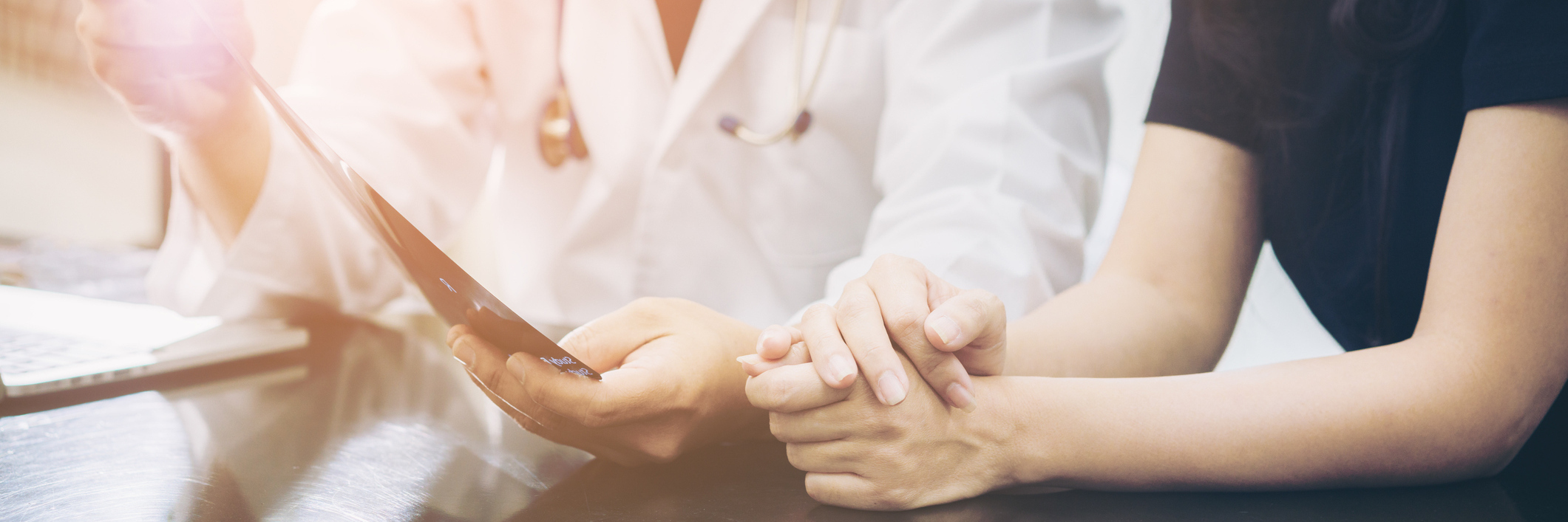 What Doctors Don't Tell You When You Become Chronically Ill Doctor and patient chat over table.