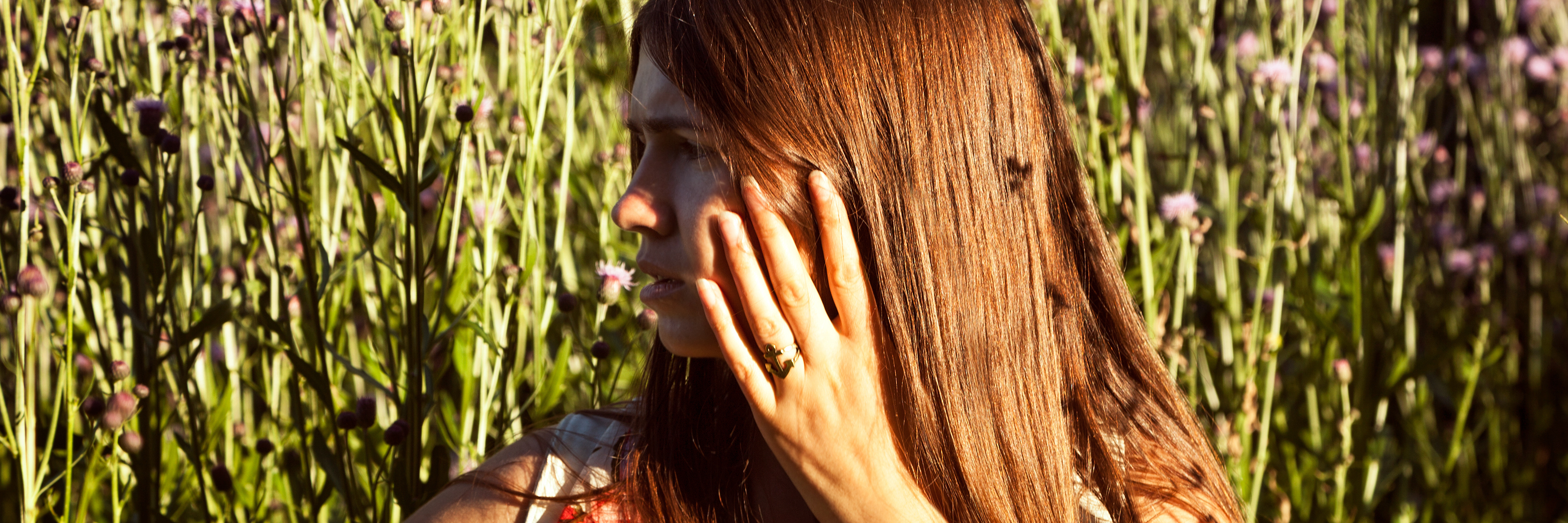 Why You Should Never Make Fun of Someone With a Phobia Woman in meadow looking afraid and anxious