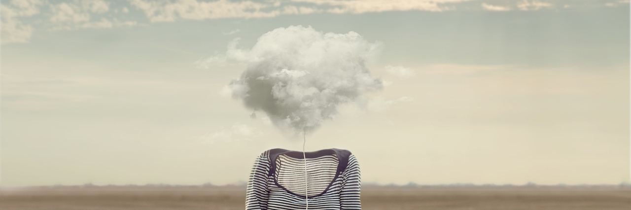 a woman whose face has been replaced with a cloud