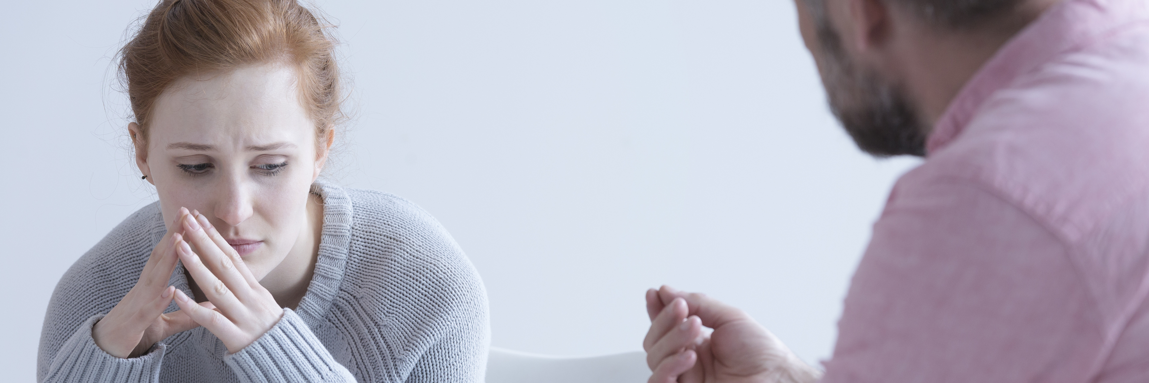 An Important Question to Ask If You Feel Suicidal young woman looking upset talking to psychologist