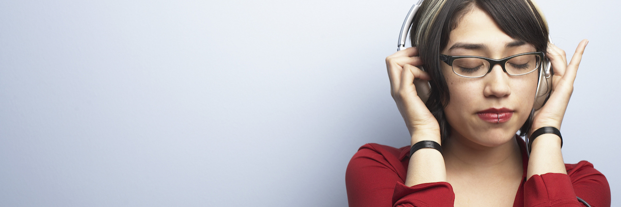 Living With Misophonia and Anxiety in a Loud World Woman with headphones