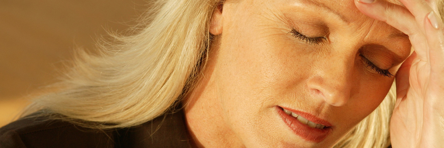 Asthma, Diabetes, Hashimoto's Disease: Challenges of Invisible Illness woman holding her head in exhaustion