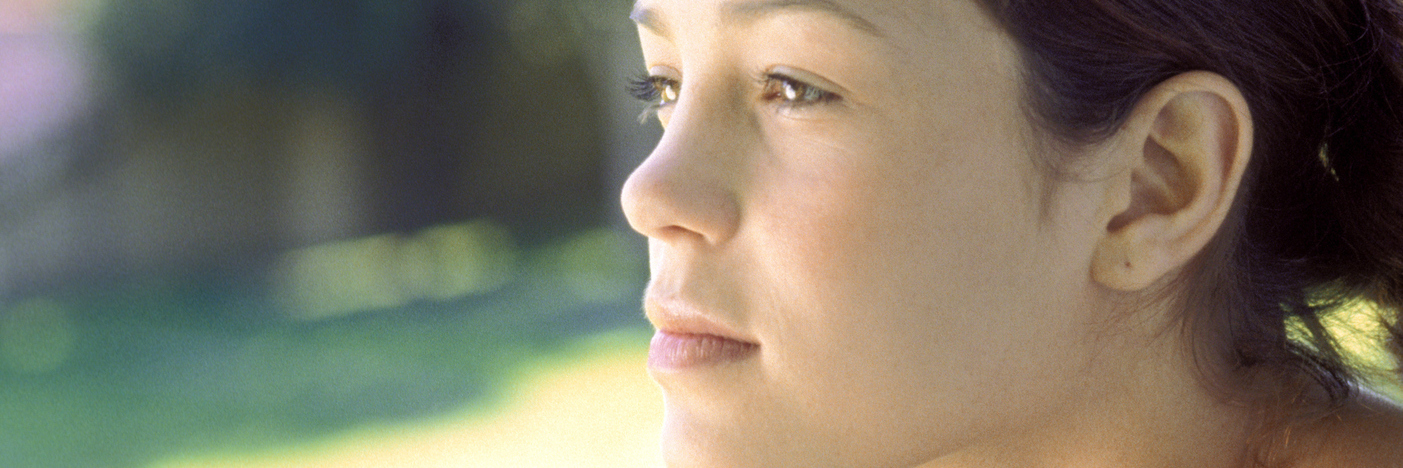 Having a Chronic Illness Doesn't Make You 'Broken' or 'Defective' woman sitting outside