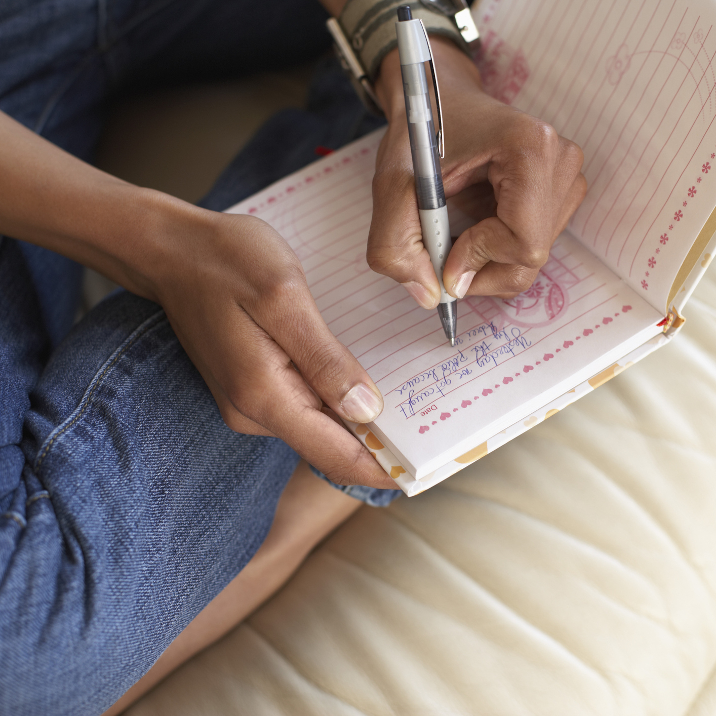 woman writing in her journal