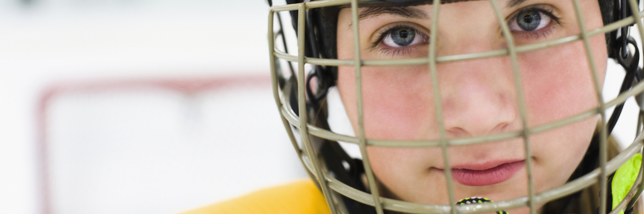 The Depression I Felt After I Stopped Playing Sports A woman playing hockey