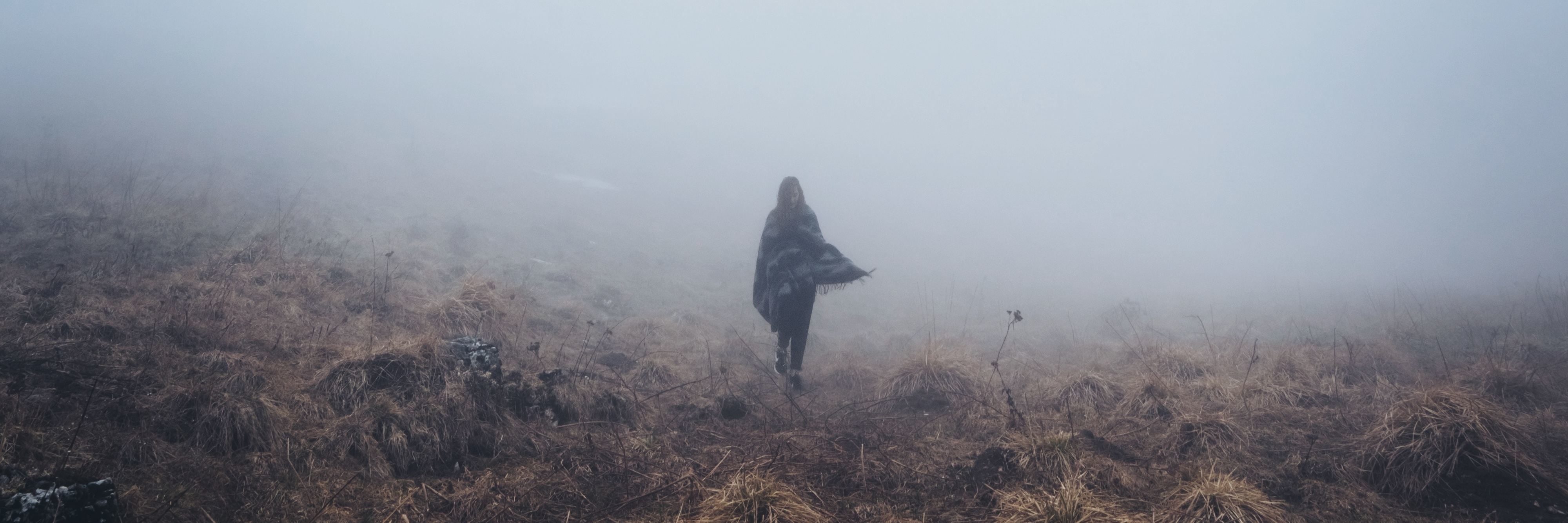 When Depression Makes You Feel Numb After Making You Feel Too Much woman walking alone through fog