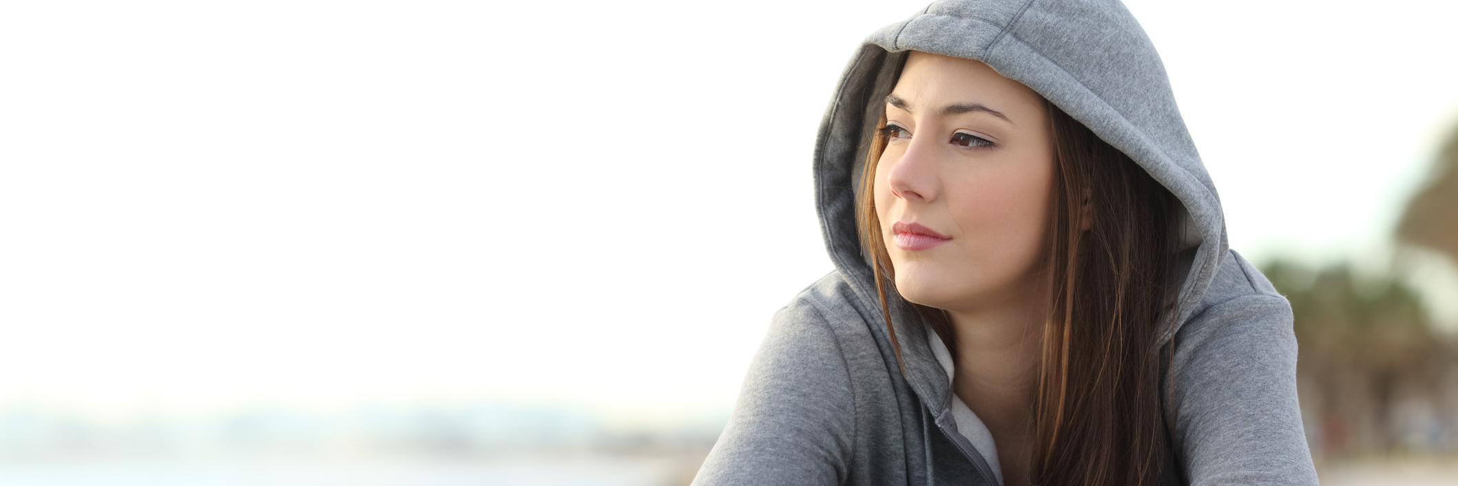 It's OK to Say the 'D' Word Around Me Close up of woman wearing a gray hoodie looking pensive