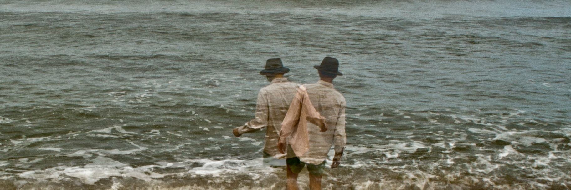 How Emotions Are Like an Open Ocean With BPD double exposure of man standing in ocean wave looking out at horizon
