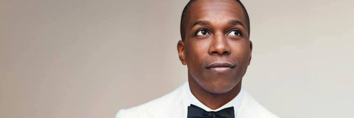 Leslie Odom, Jr. wearing white tuxedo and black bowtie