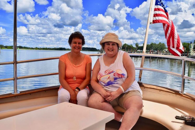 two women sitting in a boat