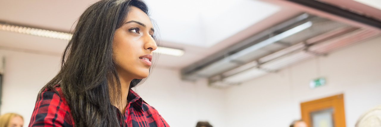 How Borderline Personality Disorder Affects My Day as a Student Semale student with others writing notes in classroom