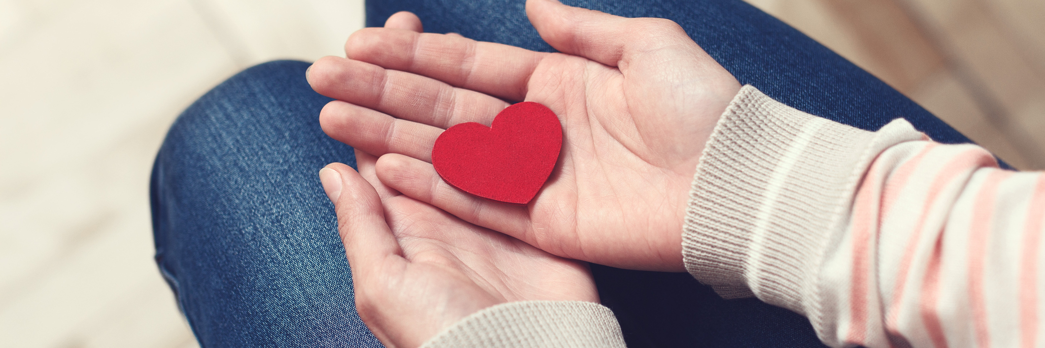 Reminders for When Your Eating Disorder Says You Won’t Find Love Girl is sitting and holding red heart in her hands on lap. Love and relationships concept