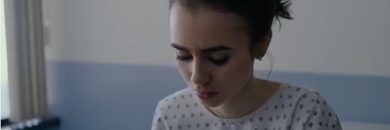 Why the ‘To The Bone’ Trailer Reinforces a Glamorized View of Anorexia lily collins in hospital gown looking down from to the bone trailer