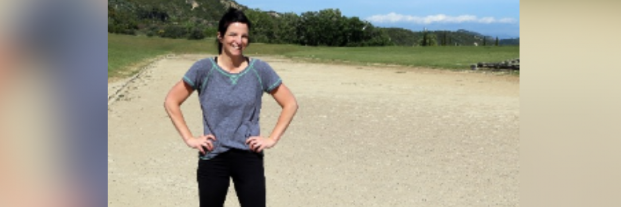 Being a Former Athlete With Chronic Illness Woman in running gear standing outside on sand