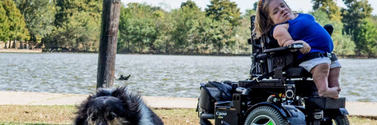 The Process of Getting a New Power Wheelchair Katherine with her dog.