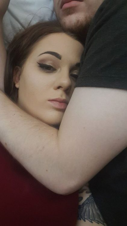 woman's boyfriend holding her in bed during a pain flare