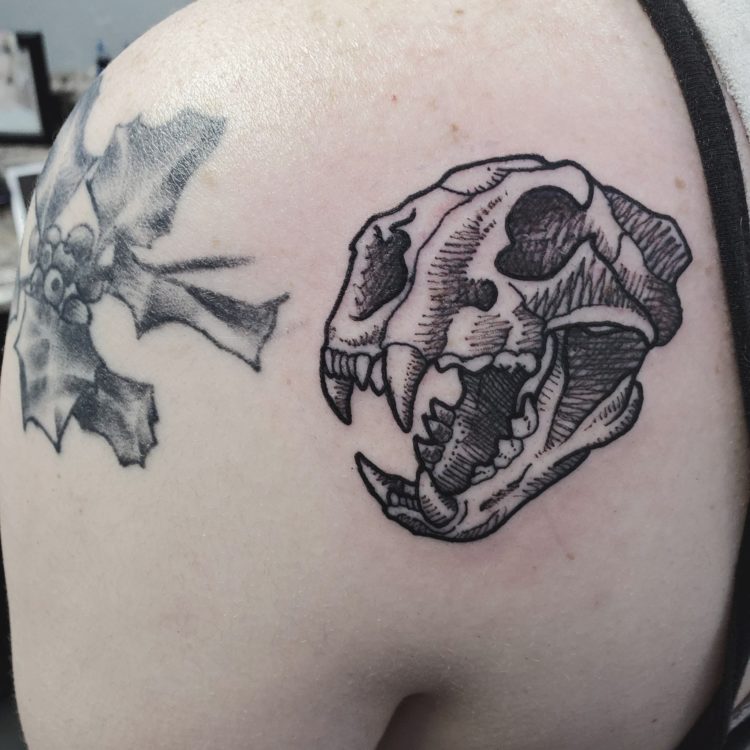 saber tooth tiger skull tattoo