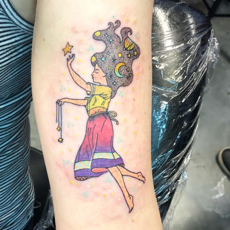 tattoo of a woman catching stars