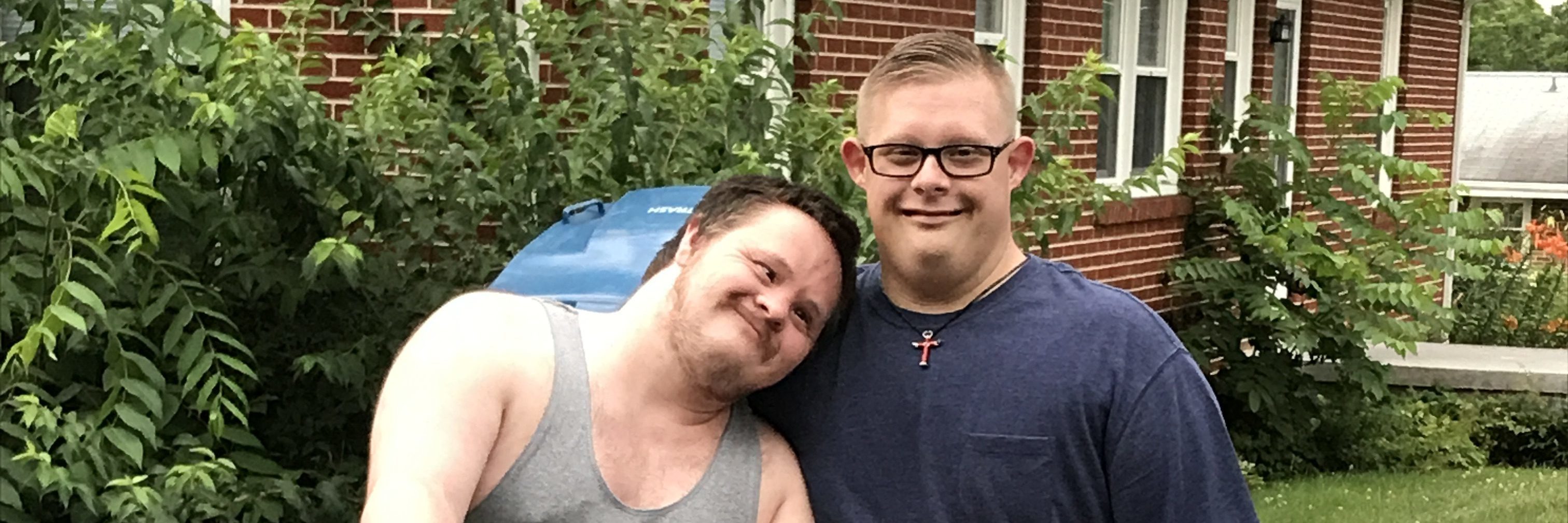 When My Son's Friend, Who Also Has Down Syndrome, Gave Him a Bike Charley on the new bike with Trevor standing by his side.