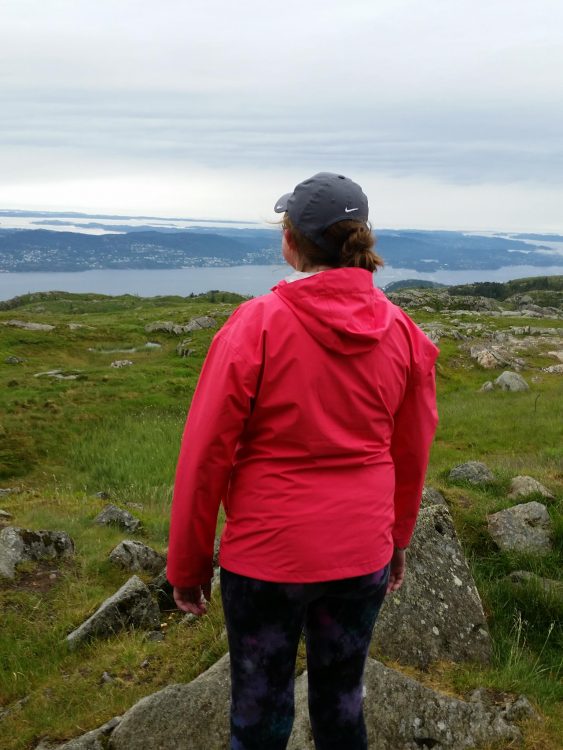 woman standing on a fjord in norway