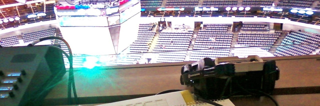 paperwork on desk overlooking NHL stadium