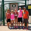 young woman with family in front of oregon university gates