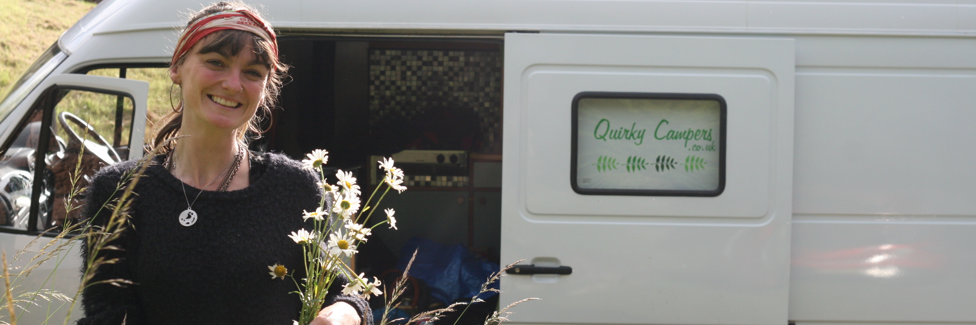 Traveling in Quirky Campers Van to Festival Due to Lyme Disease woman picking wildflowers on the side of the road next to the van