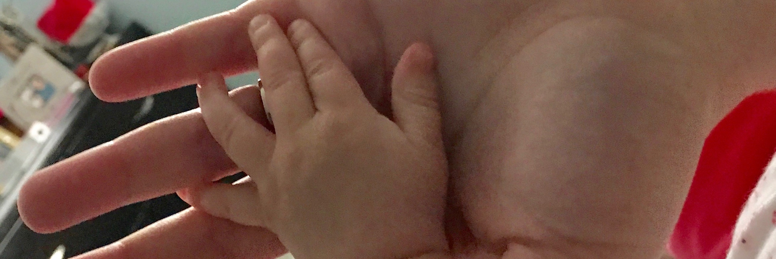 My Experiences as a New Parent With Sensory Processing Disorder Rachel and her daughter holding hands.