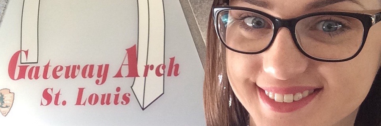 Why I Won’t Apologize for Having a Panic Attack in Public woman standing in front of the gateway arch