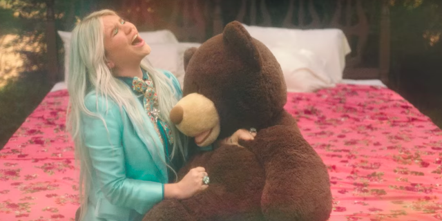 Kesha in a music video