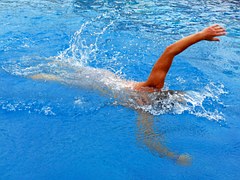 person swimming in a pool