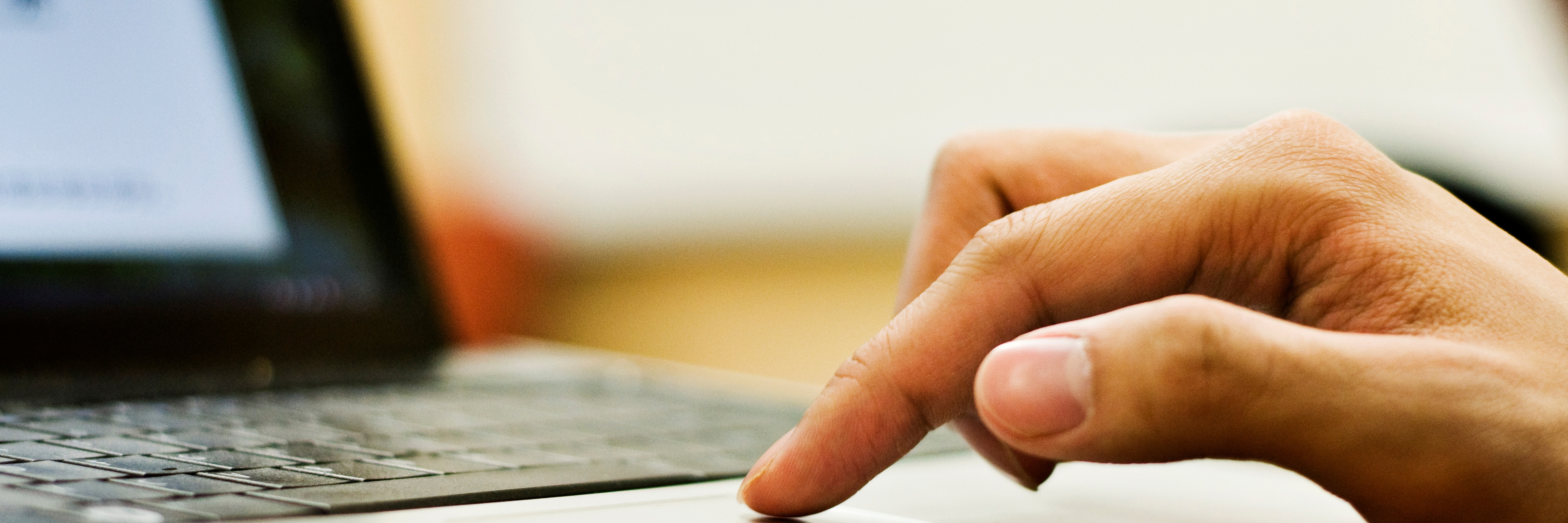 To the People Who Post About Their Mental Illness Online: Thank You Student's finger on trackpad of computer.