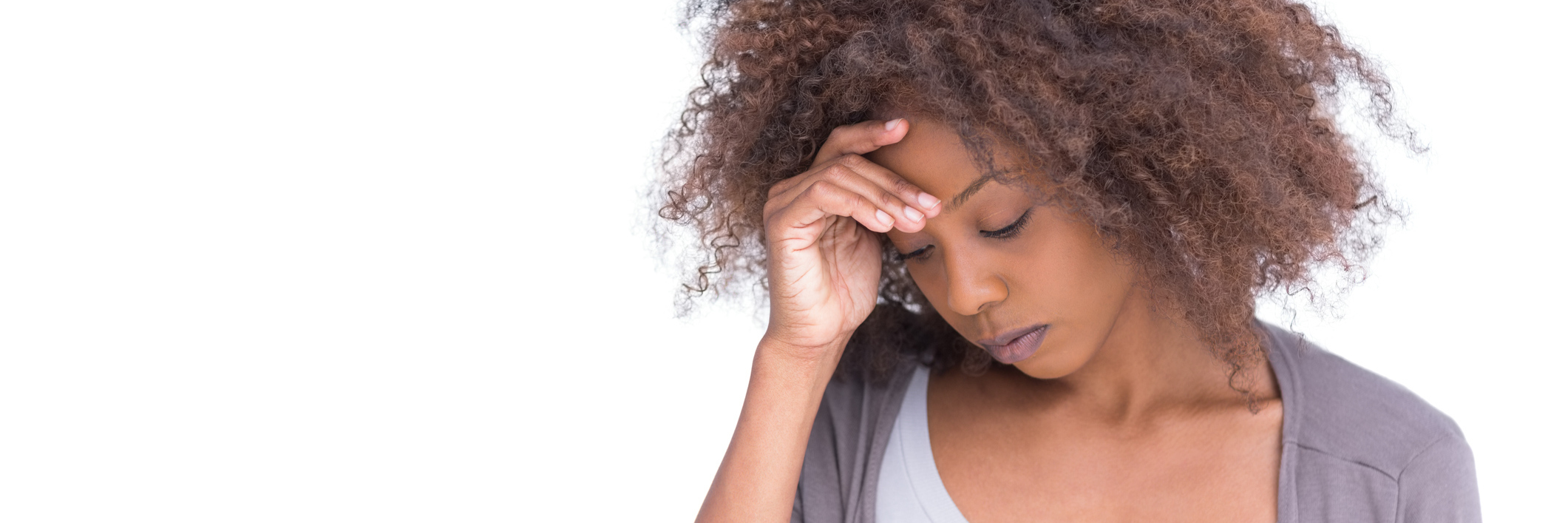 When Every Prescription for My Migraines Became an Experiment A woman holds her head in pain.