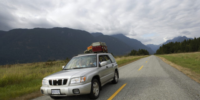 My Tips for a Road Trip With Chronic Pain and Disabilities Car on a road trip with suitcases on roof.