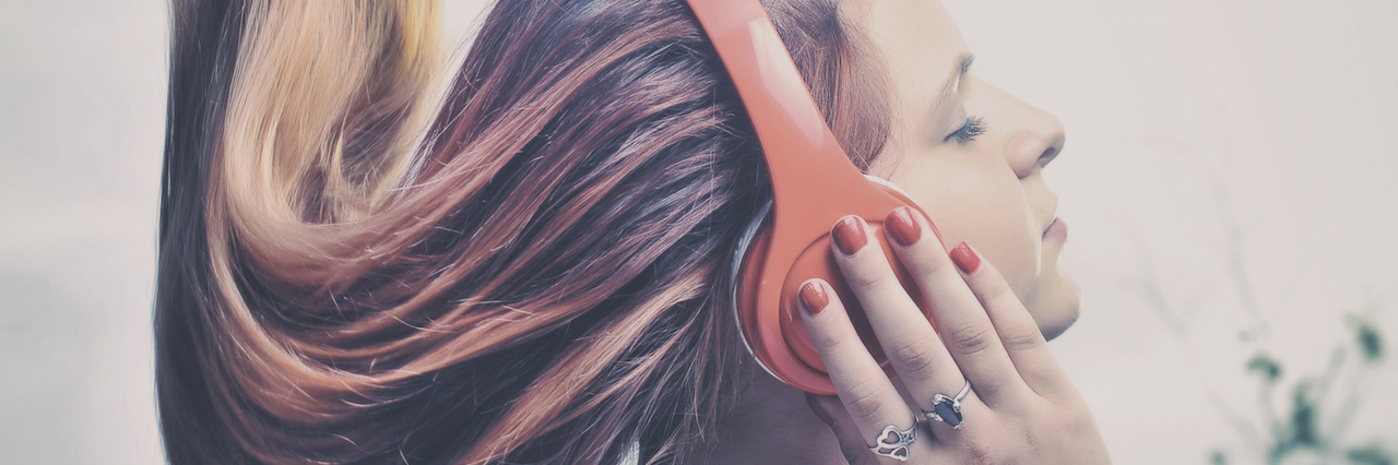 How Music Helped Me Connect With People at a Psychiatric Hospital A woman listening to music