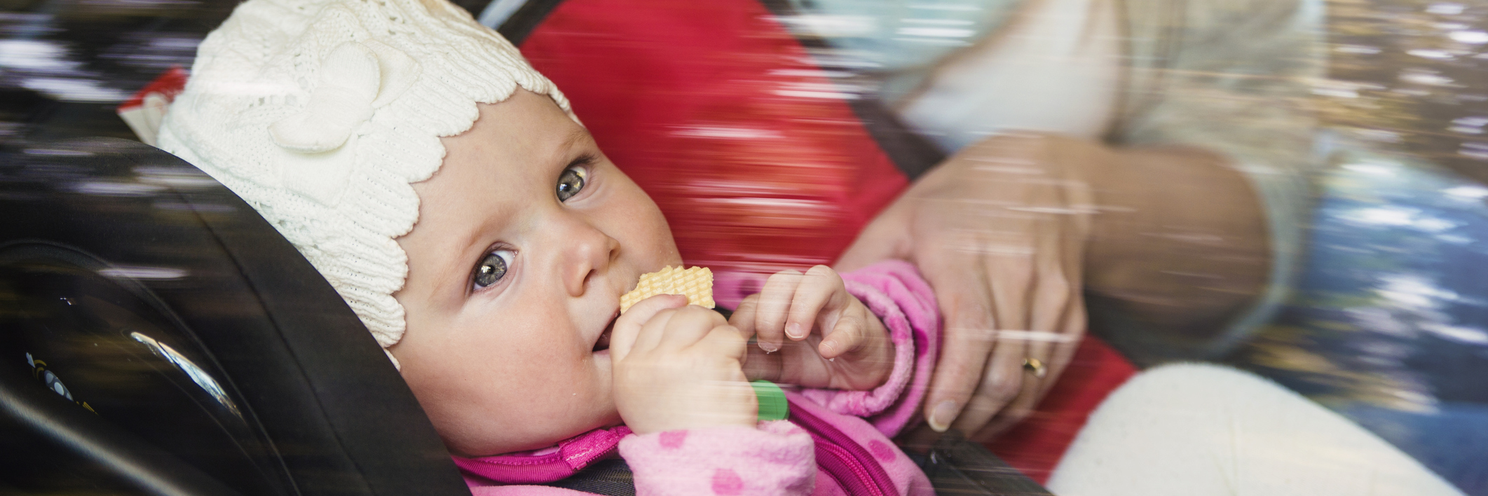 Struggling Alone and Finding Hope With Postpartum Anxiety baby girl in child seat in car with mother next to her