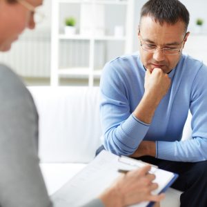 Therapy client meeting with therapist