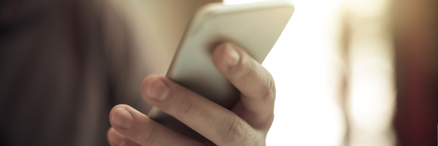 Multiple Sclerosis and Cognitive Issues: My Experience Hand holding cell phone