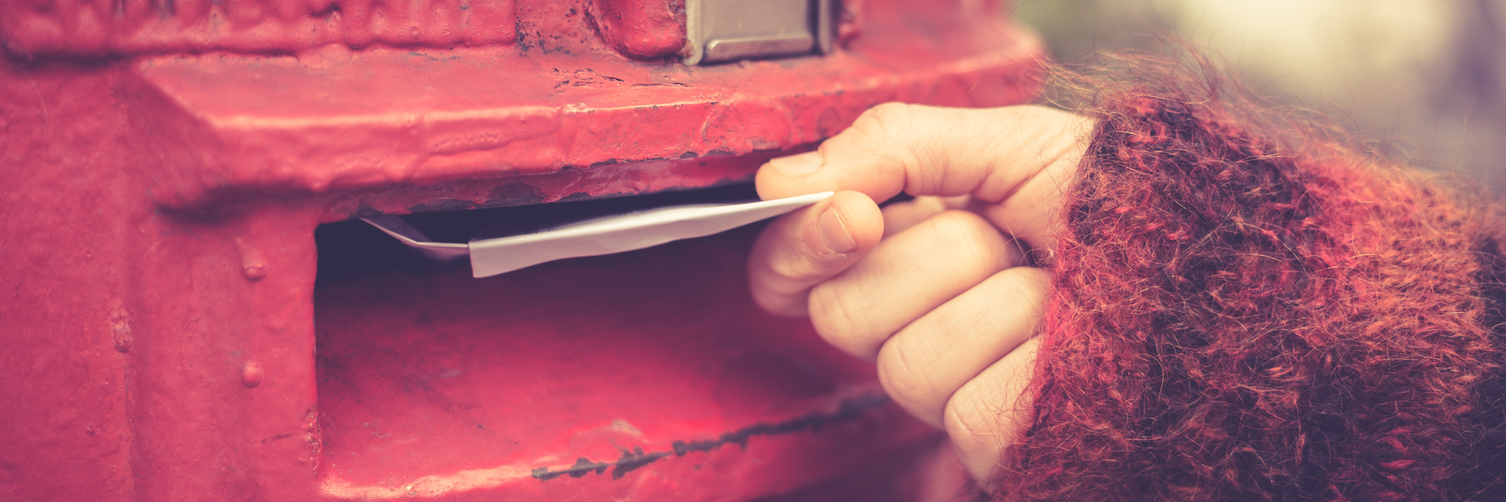 Spoonie Card Swap Matches People With Illnesses to Exchange Cards Closeup on a woman's hand as she is posting a letter