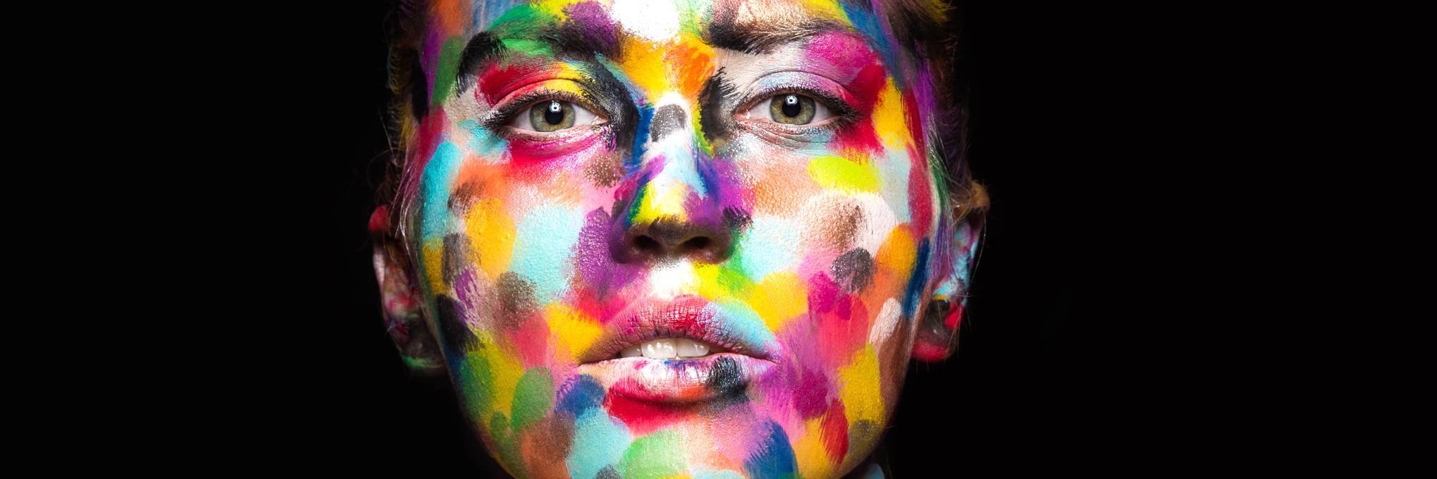 Fibromyalgia: Asking for Help When You Have a Chronic Illness woman with her face painted in multi-colored spots