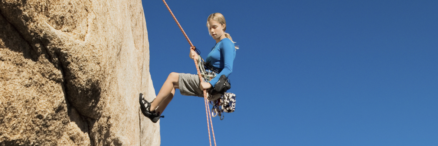 Chronic Illness: Having Fun Even Though It Will Cause You Pain Later Woman Rappelling on Cliff