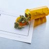 photo of marijuana spilled over a prescription