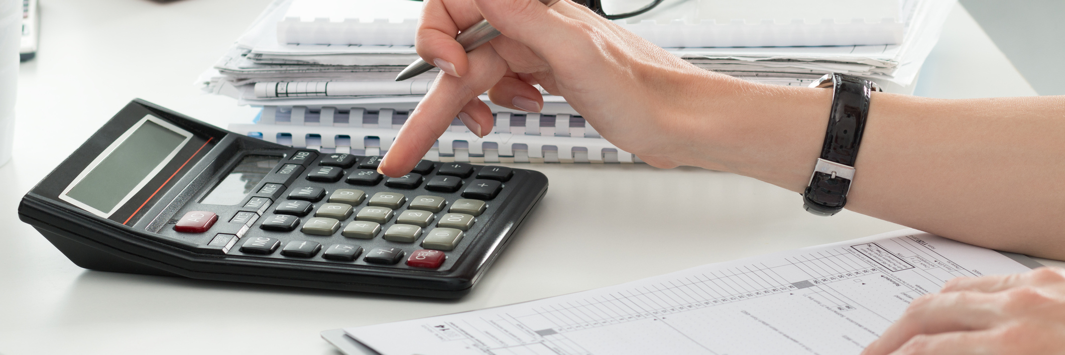 Out-of-Network Costs for Doctors and Treatment With Lyme Disease woman entering numbers on calculator