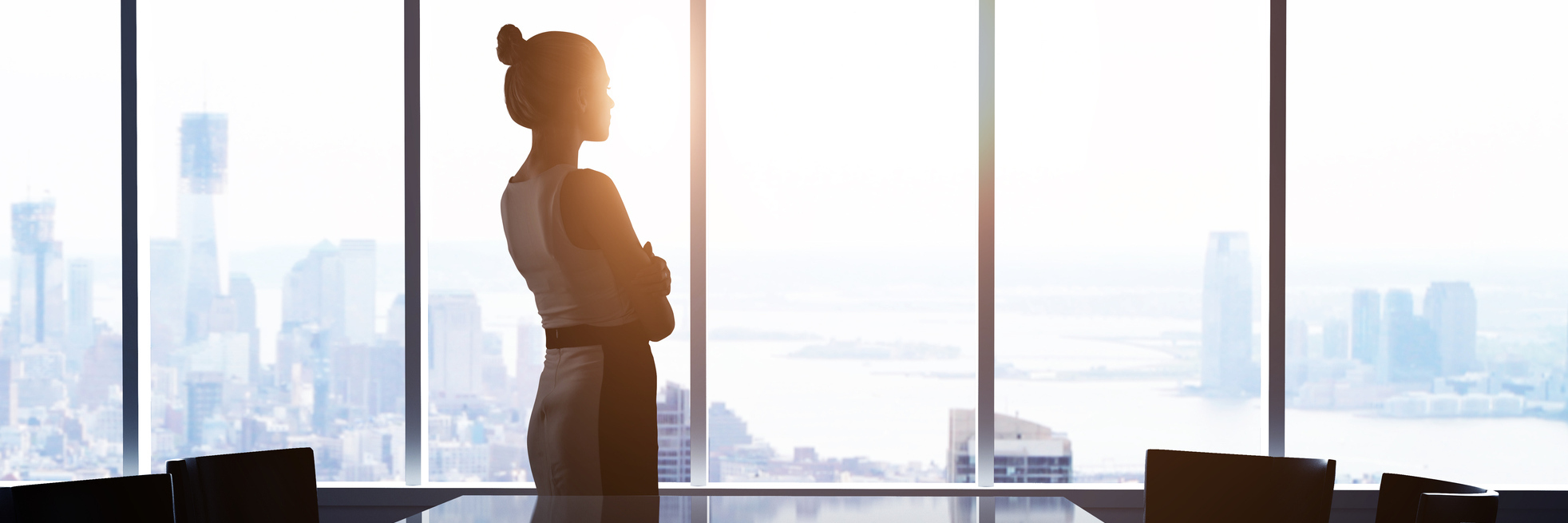 Going Back to Work After Years of Struggling With Fibromyalgia businesswoman looking out office window