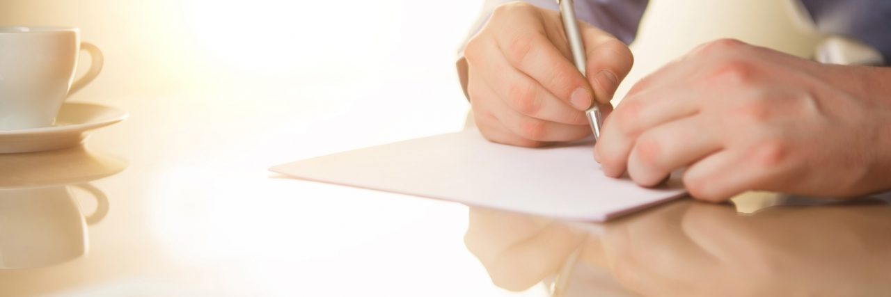 A Letter to My Son With Neurofibromatosis Type 1, From Dad man writing letter at desk