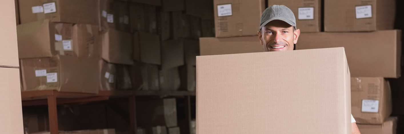 Requesting Workplace Accommodations for a Disability Worker carrying boxes in the warehouse.