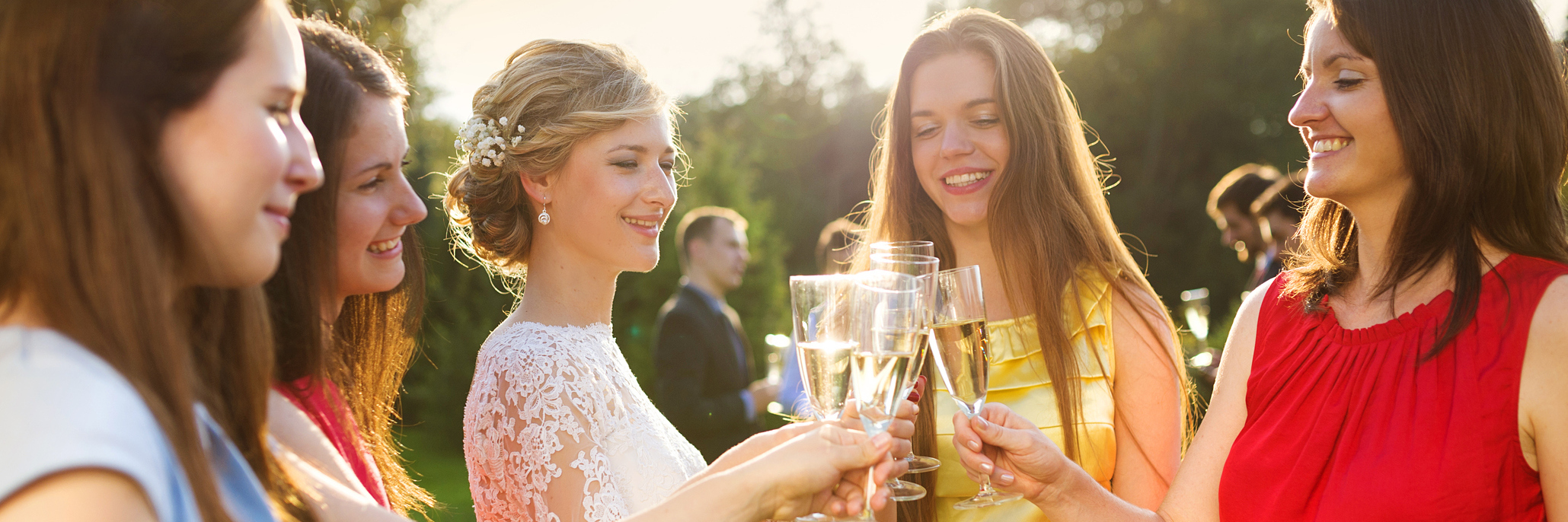 How to Support Someone With Chronic Illness at an Event or Party bride and bridesmaids clinking glasses at a wedding reception