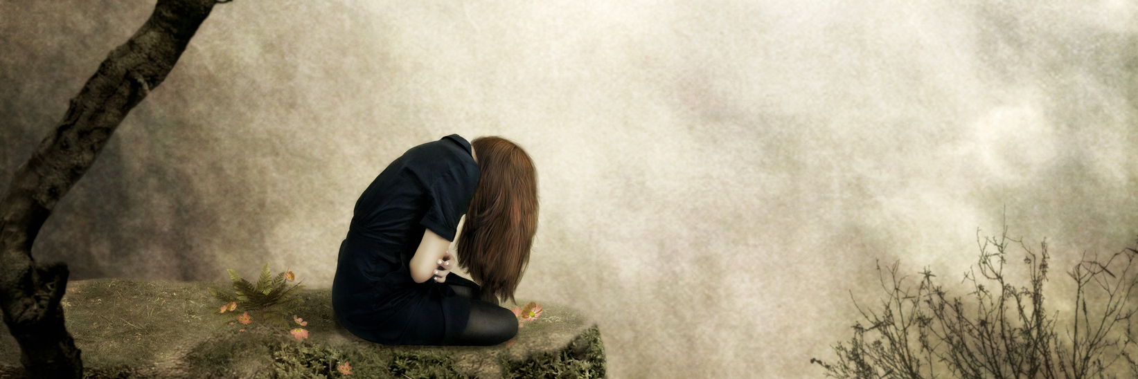 Things I Shouldn't Feel After My Colon Cancer Diagnosis Lonely girl sitting on a rock in sorrow